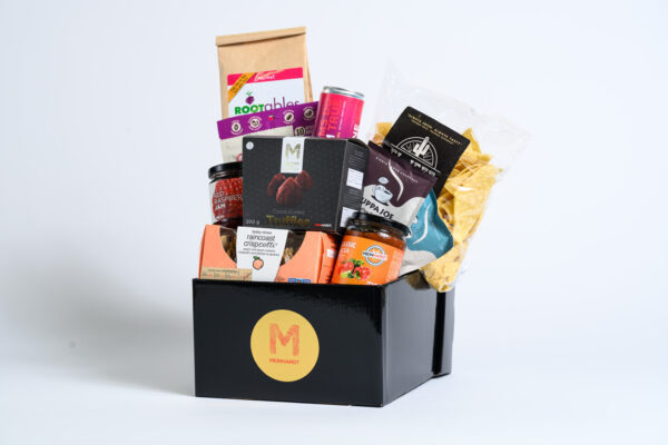 Local within BC snacks with different colored packaged placed in an intricate arrangement in a Meinhardt black gift box